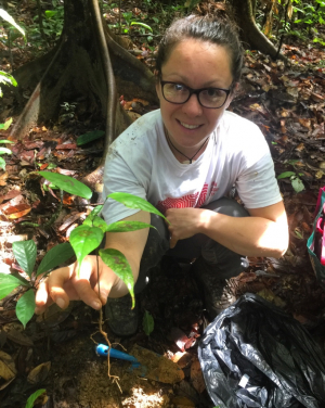 Dr Hannah Griffiths with a seedling.